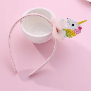 Pink unicorn headband for girls with glitter accents and soft tulle flower decoration