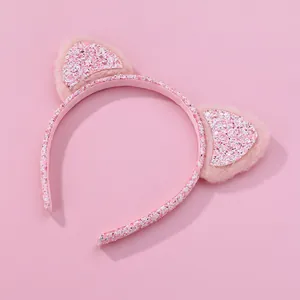 Sweet pink cat ear headband with plush trim and glitter details for girls' party wear