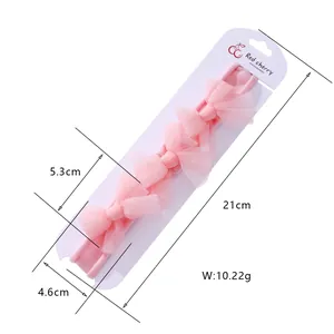Détails du bandeau rose à nœud montrant la longueur 21cm et le poids de 10,22g