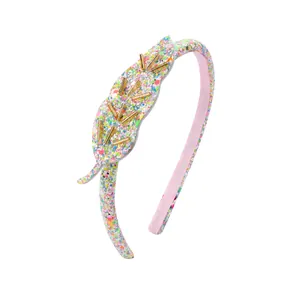 Serre-tête feuilles à paillettes colorées avec perles dorées sur fond blanc