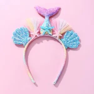 Rainbow mermaid headband with glittery purple tail and blue seashell decorations