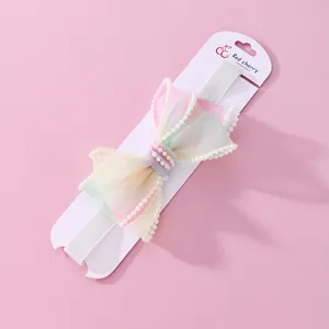 Fascia elastica per neonati con fiocco in organza pastello e perle eleganti