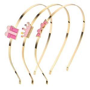 Set aus drei goldenen Haarreifen mit rosa Emaille-Kronen und Schleifen-Verzierungen