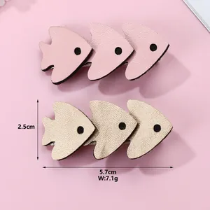 Pair of cute fish shaped hair clips in pink and champagne gold leather for girls