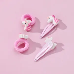 Vue détaillée du lot de barrettes licorne roses et d'élastiques à cheveux pour enfants
