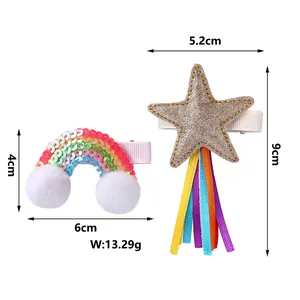 Rainbow sequin clip with pompom and gold star hair clip with colorful hanging ribbons