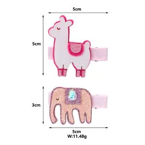 Detailed view of pink glitter alpaca and elephant hair clips with size and weight labels