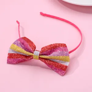 Pink girls headband with a colorful sequin bow and non-slip glitter finish accessory