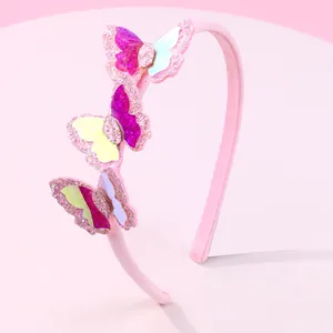 Detail of pink glitter headband with 3D sequin butterflies in vibrant colors