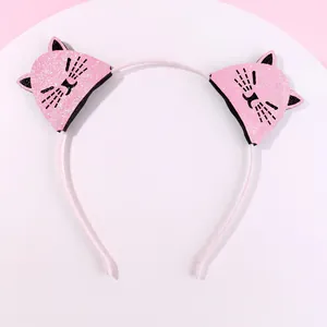 Detailed view of pink sequin cat ears on a non-slip headband for little girls