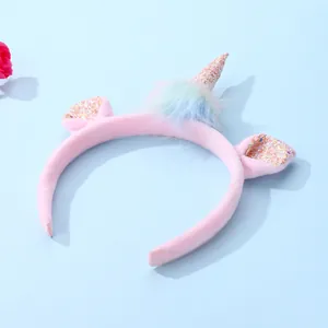 Pink plush unicorn headband for kids with shiny sequins and rainbow faux fur details