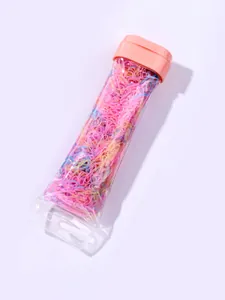 Macro view of colorful high-elasticity hair bands in a transparent hanging tube
