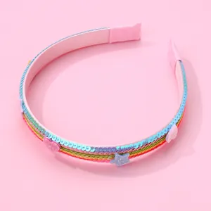 Rainbow sequin headband for girls featuring pink heart and blue star decorative accents