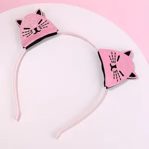 Pink sequin cat ear headband with cute facial features for girls on white background