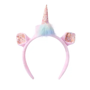 Cute pink plush unicorn headband with glitter horn and colorful faux fur decor