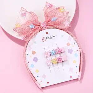 Pink girls' headband set with mesh bow, glitter heart and star hair clips on display card