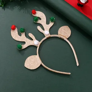 Golden glitter reindeer antlers headband with festive colorful pompoms for Christmas party