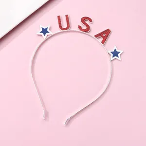 Close-up of USA letters with red glitter and blue stars on a silver metal headband