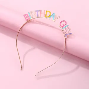 Detail of BIRTHDAY GIRL rose gold headband with colorful enamel letters on pink background