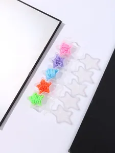Star-shaped organizers with colorful rubber hair bands on modern geometric background