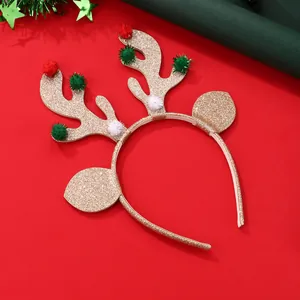 Sparkly gold sequin reindeer antler headband with colorful pom poms on a festive red background