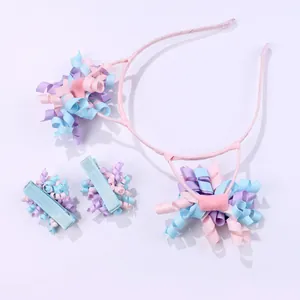 Detail of sweet macaron-colored curly ribbon headband and clip set for girls