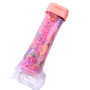 Colorful elastic hair ties set in clear container with pink lid for kids hair styling