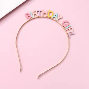 Detail of BIRTHDAY GIRL headband with colorful macaron enamel letters on gold metal