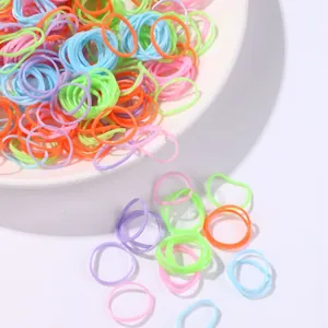 Colorful high-elastic macaron hair ties set for kids hair styling in white ceramic plate