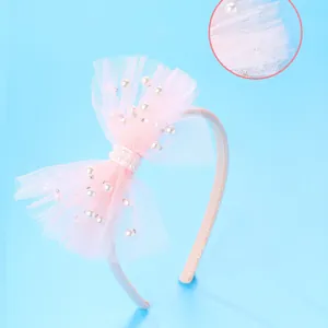 Pink mesh bow headband for girls featuring delicate white pearls and sparkling texture