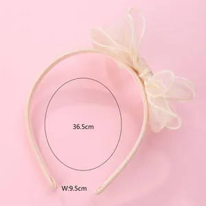 Pink headband with layered mesh bow detailing, dimensions 36.5cm length and 9.5cm width