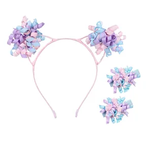 Close-up of three-piece girl's hair set with pink curly ribbon flowers on white background