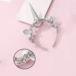 Children's silver unicorn headband with glitter ears and sequin stars for parties