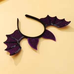 Detail of Halloween headband with purple glitter bat wings and black sequin trim