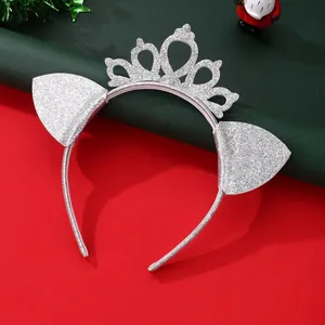 Detail of silver glitter cat ear headband with hollow crown on Christmas background