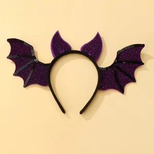 Detail of bat wings headband with purple glitter and black sequins for Halloween parties