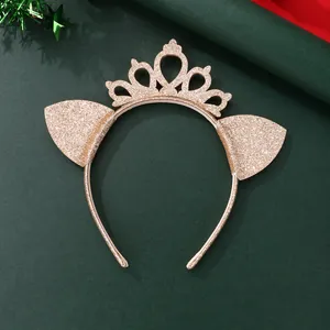 Detail view of champagne gold glitter cat ears headband with a crown on festive background