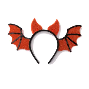 Halloween headband with orange sequined bat wings and devil horns on a black band