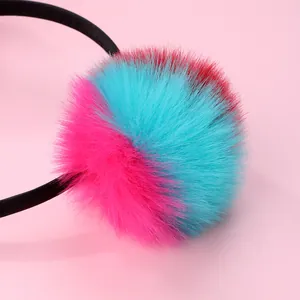 Close-up of a colorful plush ball on a headband featuring pink and blue fibers