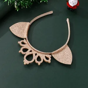 Sparkling gold crown cat ear headband for kids Christmas party accessory on green background