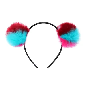 Charming children's headband with colorful oversized pom-poms and anti-slip black frame