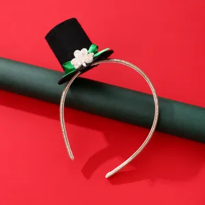 Detail of St. Patrick's Day headband with black mini top hat and glittery clover