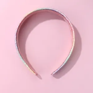Rainbow glitter headband for girls featuring vibrant sequins and a soft pink fabric lining