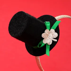 St. Patrick's Day mini top hat headband with green ribbon and gold glitter shamrock