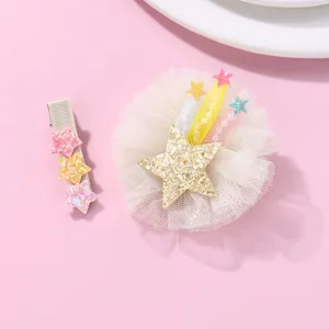 Cute children's hair clip set with tulle flowers and sequin stars on pink background