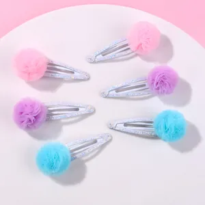 Détail de pinces à cheveux boules en tulle colorées et pailletées, lot de 6