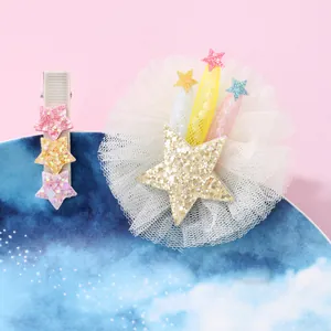 Detail of children's hair clips featuring colorful glitter stars and white mesh lace layers