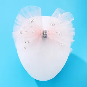 Pink tulle bow headband for girls with elegant faux pearls and silver glitter center
