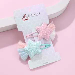 Glittery star hair clips with tassels for kids in pink and blue, 2-pack set