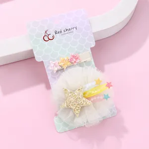 Sweet children's hair clip set with glitter stars and pastel mesh floral tassels